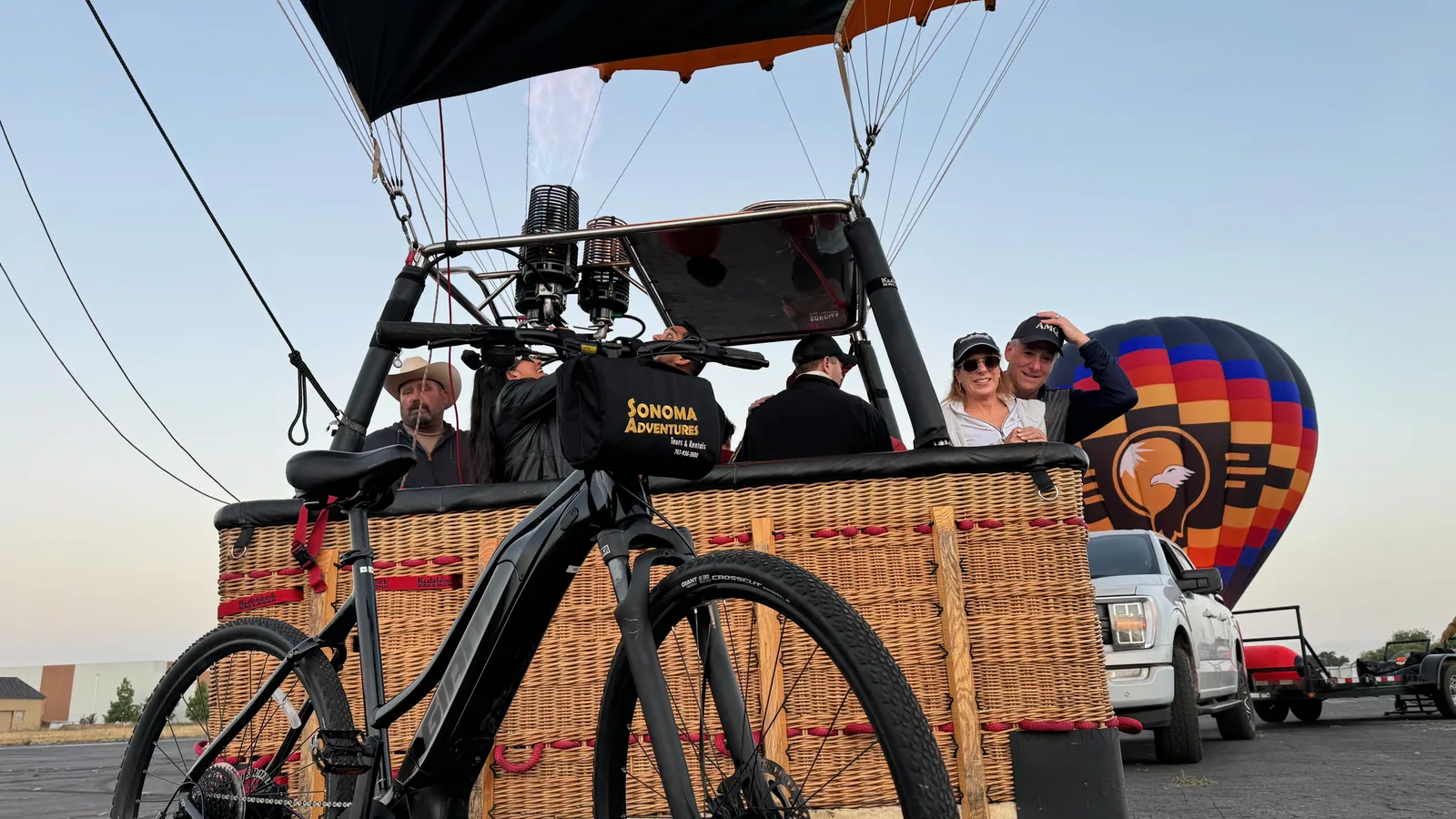 Guests standing in a Sonoma Ballooning basket at Sonoma Skypark before a sunrise flight