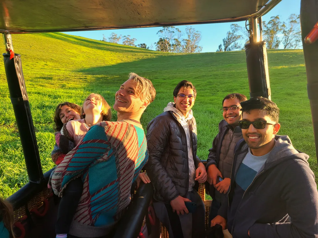Friends laughing together after a balloon flight